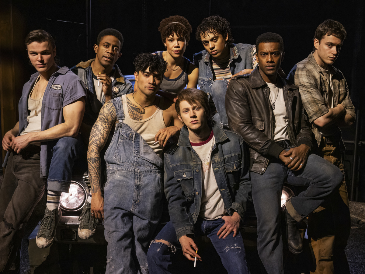 cast members of The Outsiders sit together